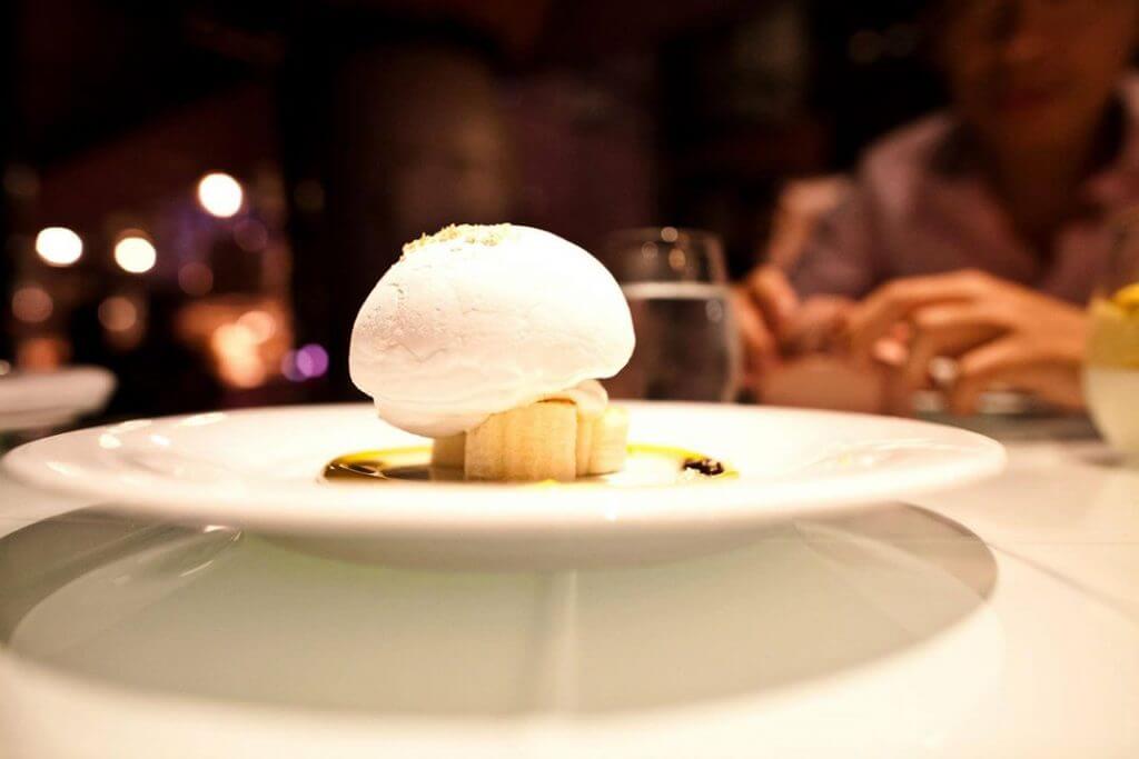 Nitro Coconut Floating Island-The coconut puff basking on fresh banana slices was fluffy & light. 